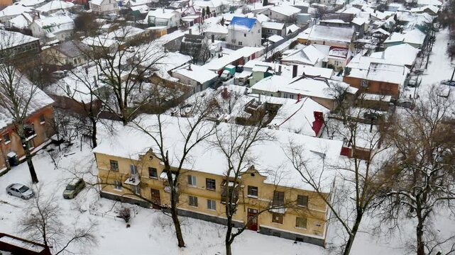 Voronezh, Russia, January 3, 2026: Winter residential area of ​​Voronezh with private sector and multi-story buildings, view from above