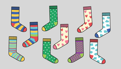 Obraz premium Lovely collection of colorful cute patterned socks with stripes, hearts, clouds, and dots on a grey background.