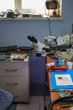 Workplace of an electronics repairman. Computer repair. Equipment maintenance.