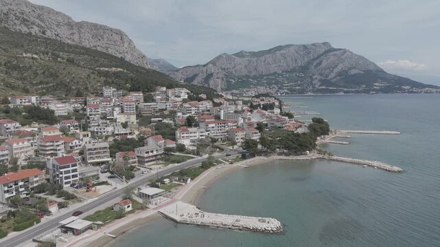 Aerial View of Mediterranean Coastal Town and Turquoise Bay