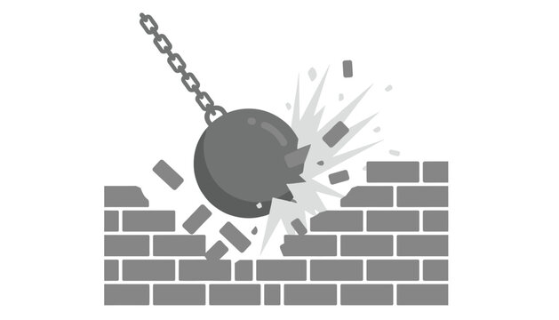 Industrial wrecking ball smashes into a brick wall causing damage and debris during a demolition or building renovation process in urban areas.