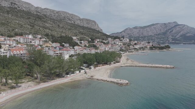 Aerial View of Mediterranean Coastal Town and Turquoise Bay