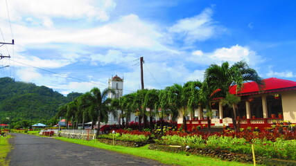 Traditional Samoan Village with White Church and Red Roof Building © VJH Photography