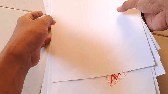 Red rubber stamp APPROVED on torn white paper with data background. Business document, contract, agreement. 4K video for paper background, white background, stamp, torn paper, data, business, office