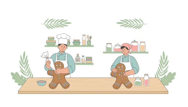 Professional kitchen setting with two chefs decorating freshly baked gingerbread cookies with colorful icing while standing at a wooden table.