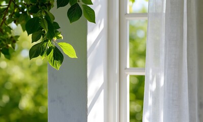 Fototapeta premium View of a window frame creating a very soft subtle shadow on a white wall, bright green leaves visible outside in soft bokeh creating a fresh backdrop