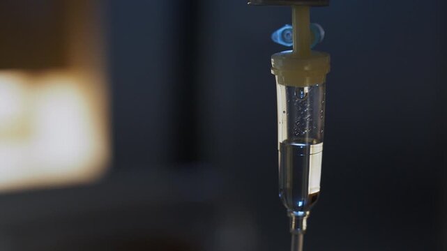 Close Up Cinematic 4K Video of Medical IV Drip Saline Drop Intravenous Therapy Hospital Healthcare
