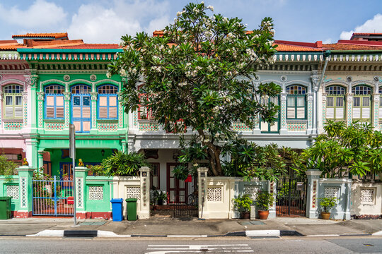 Front facade view of the iconic colorful pastel Peranakan shophouses on Koon Seng Road in Katong, Singapore