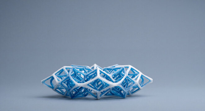 Futuristic 3D printed lattice structure, an intricate blue and white geometric design exemplifying advanced computational modeling and additive manufacturing innovation