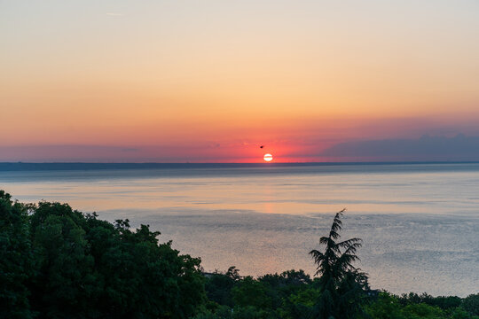 Sunrise Above the Sea with Cloud Crossing the Sun