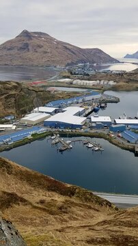 Aerial view of large fish processing factory on Unalaska island Alaska. Commercial fishing industry and vessels