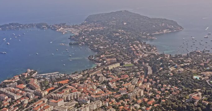 Villefranche sur Mer France Aerial v4 birds eye view overseeing luxury neighborhood of saint-jean-cap-ferrat, panoramic pan toward port beaulieu-sur-mer - July 2021