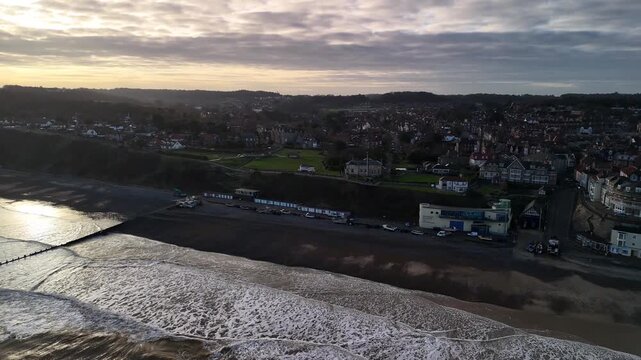 Sunset Aerial View of Cromer Beach and Backlit Coastline in Norfolk England