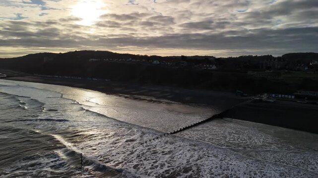 Dramatic Sunset Aerial View Over Cromer Beach and Sea in Norfolk England Coast
