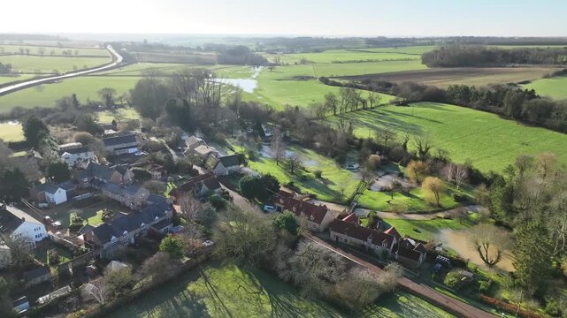 Aerial Backlit View of Sudborough Village with Winding River in Northamptonshire England