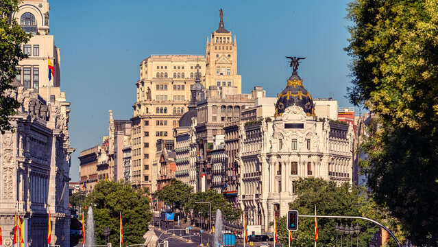 Wide panoramic view of Gran Via and the Metropolis Building in the historic center of Madrid