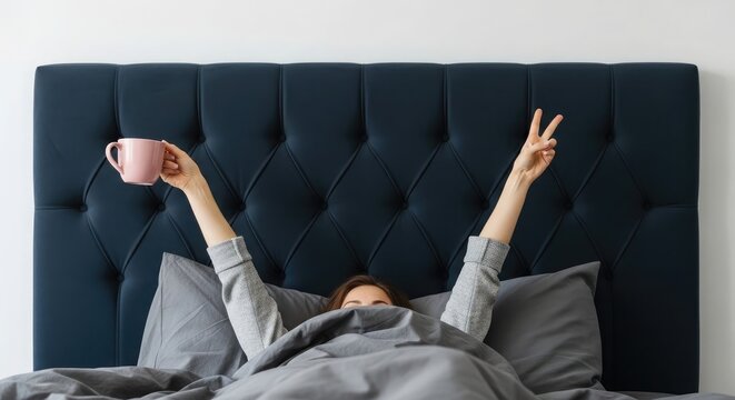 Morning coffee in bed woman enjoying hot beverage relaxing lifestyle cozy bedroom scene