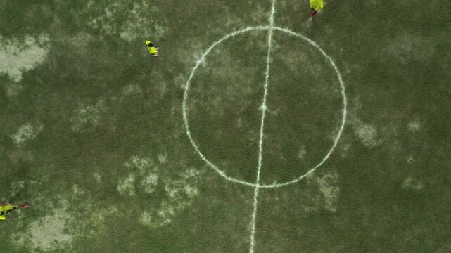 Aerial View of Soccer Match on Grassy Field