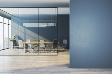 Modern corporate meeting room behind glass walls with empty blue wall foreground as clean mockup space for design templates. 3D Rendering