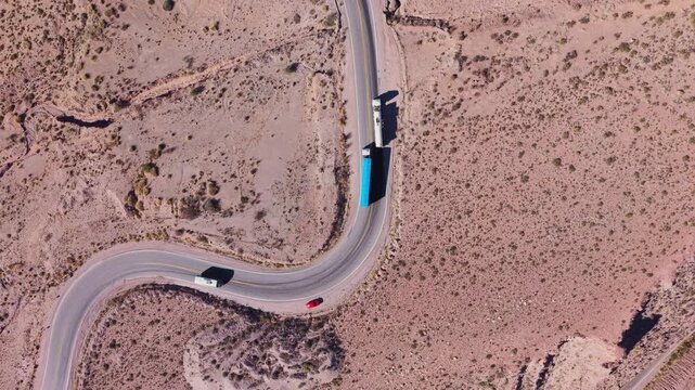Drone view of curved road in arid Cuesta de Lipan mountains, Jujuy, Argentina