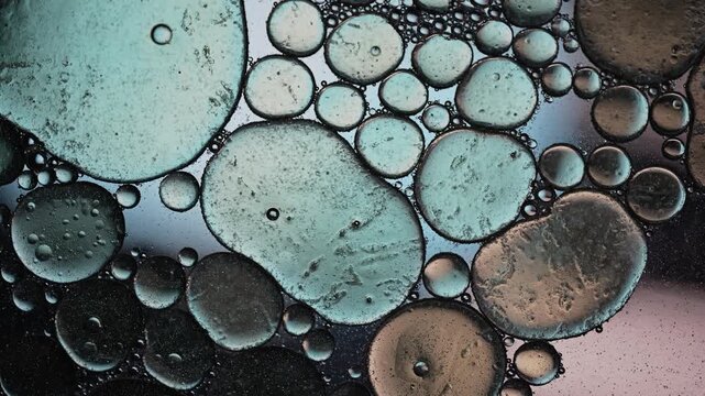 Horizontal Teal and Grey Oil Bubbles Texture in Slow Motion