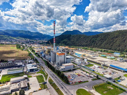 Aerial drone view of Mondi SCP paper mill and Ruzomberok surrounded by mountains, Slovakia