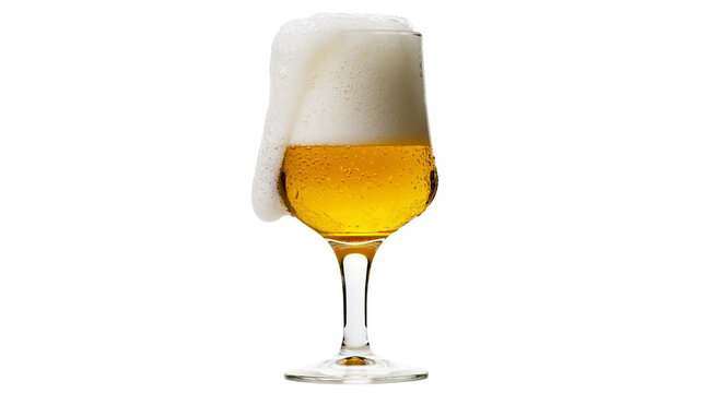 Glass of golden beer with overflowing foam