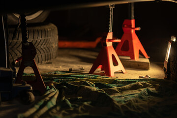 Car support stands repair with tools and light © Альона Коваль