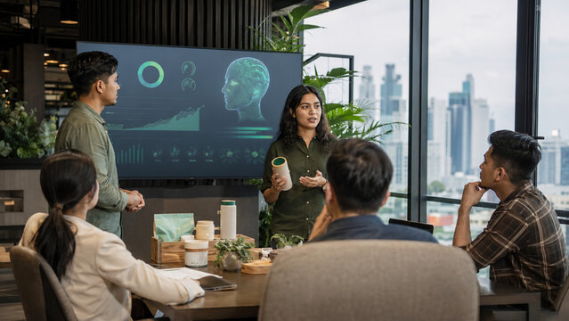 Green startup founders presenting sustainable product prototypes and AI insights