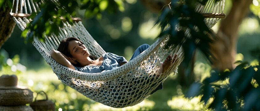 Man relaxes in hammock under leafy trees. 64k 8k widescreen, HDR