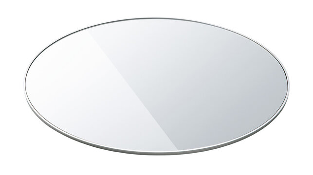 Oval mirror with thin silver frame reflecting light