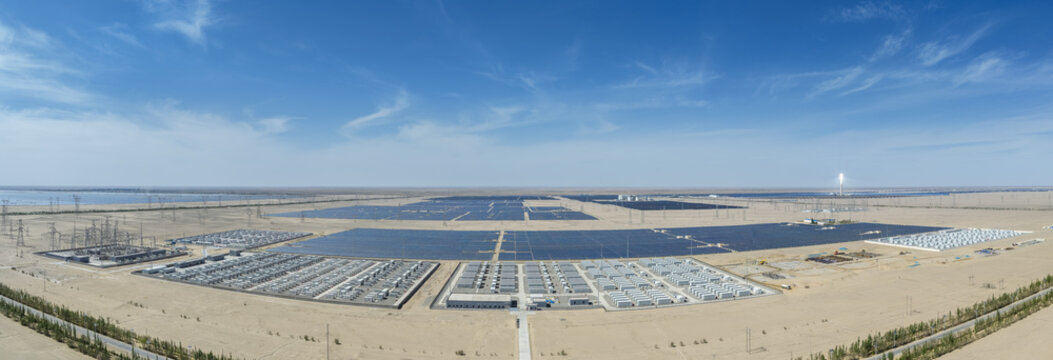 Vast Desert Energy Complex Featuring Solar Arrays, Battery Storage Farms, and Transmission Infrastructure