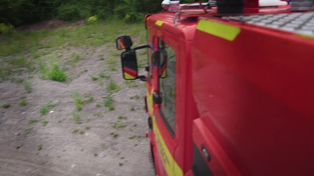 Firefighters Exiting Fire Engine During Emergency Response Drill