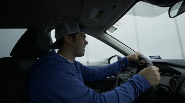 Man Driving Car Across Golden Gate Bridge in Rain And Fog - Interior Shot