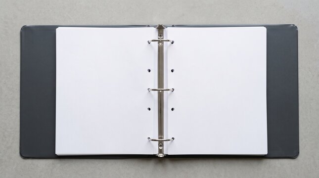 Open empty three-ring binder folder with metal rings and blank white pages on a neutral gray office background stationary organizer