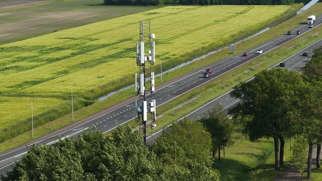 Telecommunication tower providing network coverage over a busy highway