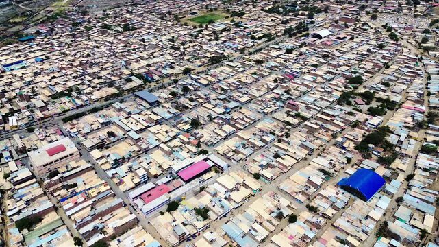 Top Down Drone View of Dense Ecuador Coastal City Blocks, Rooftops, Narrow Streets, Urban Grid and Residential Architecture Pattern