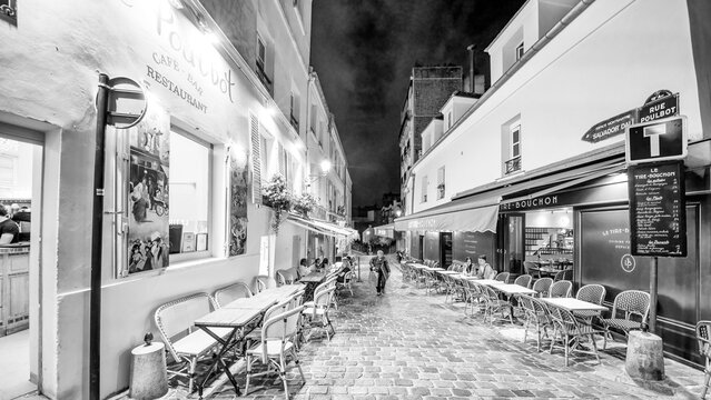 Monochrome nighttime streets of Montmartre Paris France.