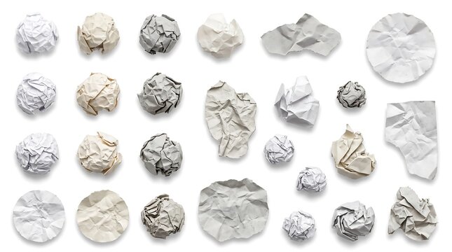 Assorted crumpled and flat white paper balls scattered on a plain background.