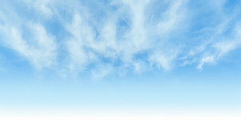 Wispy white clouds drift across a vibrant, clear blue sky, evoking a sense of peace and endless possibility. © LumenCraft