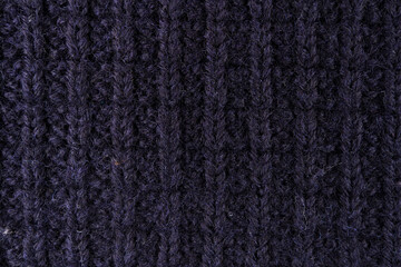 Fototapeta premium Close-Up Navy Wool Knit Sweater Texture Showing Ribbed Yarn Pattern And Cozy Fabric Detail