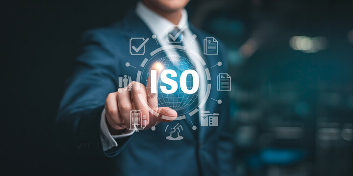 iso standard certification quality control and compliance concept with businessman hand pressing virtual screen interface with global world map and corporate audit icons