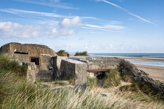 An old World War II concrete bunker of type H612 at German strongpoint Wn10 on the sandy dunes of Utah Beach in Saint-Martin-de-Varreville.