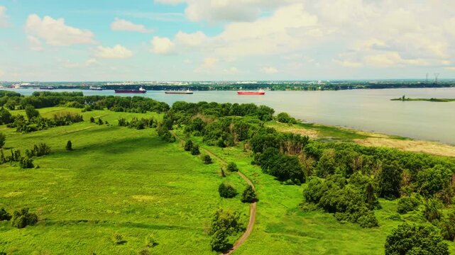 Boucherville, Canada - June 22 2026: A spectacular 4K aerial sweep over the Saint Lawrence River near Boucherville, capturing serene island channels, lush green coastlines
