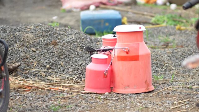milk storage container  in Rural India &ndash; Agricultural Farming, 4K Footage