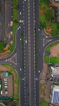 Aerial view of Aba Road highway junction with traffic flowing through the urban landscape of Port Harcourt, Rivers, Nigeria.