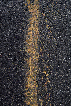 Dark black background created with an asphalt road