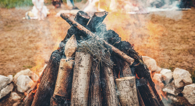 Ceremonial throwing of lavender into the sacred solstice fire.