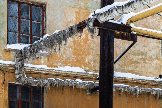 pipes with peeling thermal insulation in factory
