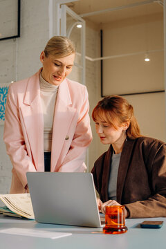 A woman uses a laptop in the office
